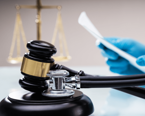 Gavel resting beside a stethoscope and medical documents, symbolizing the intersection of healthcare and the legal system in cases involving medical misdiagnosis in Oklahoma City.