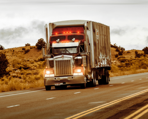 Semi-truck traveling on a highway in rural Oklahoma, illustrating commercial trucking operations and legal issues in serious truck accident injury claims and freight broker liability cases.